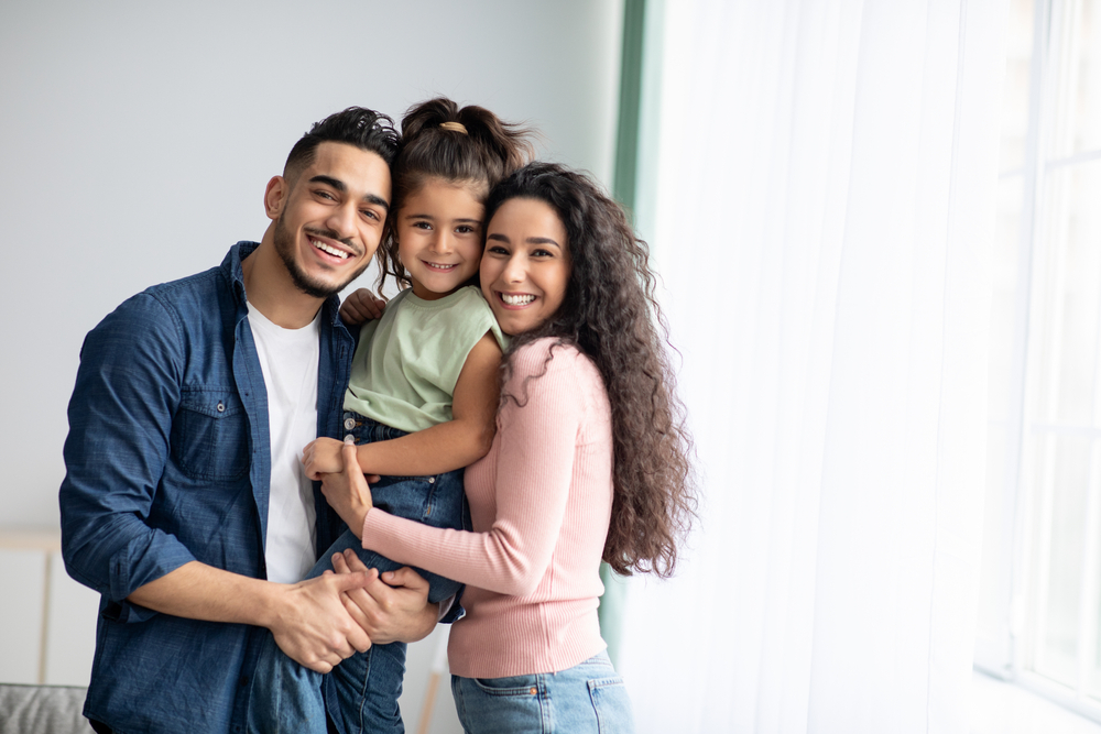 Portraif,Of,Happy,Arabic,Parents,Posing,With,Their,Little,Daughter