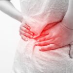 lower back pain and nausea female