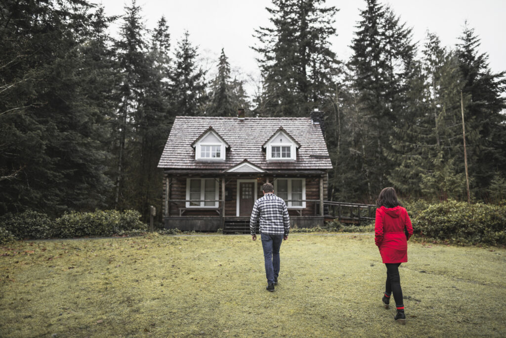 couple-heading-forest-shack