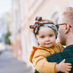father-carrying-a-baby-3662926-e1583767422649