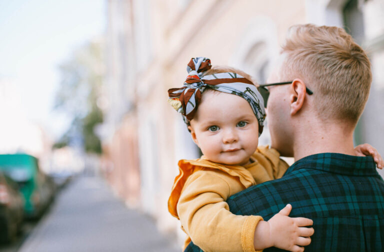 father-carrying-a-baby-3662926-e1583767422649
