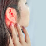 woman suffering from ear pain , Tinnitus concept