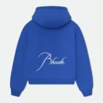 n the rapidly evolving world of fashion, few brands have disrupted the industry as boldly as Rhude Clothing. What started as a graphic tee worn by Kendrick Lamar has grown into a globally recognized luxury streetwear label, blending high-end craftsmanship with raw, cultural storytelling. Founded in 2015, Rhude has become a staple in the wardrobes of celebrities, athletes, and tastemakers. With its signature fusion of American nostalgia, minimalist design, and edgy aesthetics, Rhude Clothing reflects a new chapter in streetwear—where personal narrative meets designer-grade quality. In this deep dive, we’ll explore the origins of Rhude Clothing, what makes the brand so unique, its signature pieces, game-changing collaborations, and where it’s headed next in the world of fashion. The Origin Story of Rhude Clothing The story of Rhude begins with its founder, Rhuigi Villaseñor, a self-taught designer who immigrated from the Philippines to Los Angeles at age 11. With no formal fashion education, Rhuigi learned everything from YouTube tutorials, working with tailors, and deconstructing clothes to understand how they were made. His approach was hands-on, raw, and incredibly passionate. In 2015, he launched Rhude Clothing with a single design: a T-shirt featuring a paisley bandana print. It was a simple idea, rooted in symbolism and street culture—but it caught fire quickly. When Kendrick Lamar wore it during a public appearance, the fashion world took notice. Rhuigi’s background heavily influences the Rhude brand ethos—blending his immigrant experience, love of Americana, and aspirational storytelling into every piece. Rhude isn’t just about clothes; it’s about identity, ambition, and cultural connection. Why Rhude Clothing Stands Out In a sea of emerging streetwear brands, Rhude Clothing has managed to rise above the rest. Its success isn't based on hype alone—it's built on a careful combination of authenticity, luxury, and storytelling. Here’s what makes Rhude so unique: 1. Luxury-Grade Craftsmanship Unlike many streetwear brands that focus purely on graphic tees and hoodies, Rhude takes a more refined approach. The brand emphasizes tailoring, fit, and quality—with many of its garments produced in Italy or the United States. From double-stitched hems to heavyweight cotton and premium zippers, Rhude pieces are designed to last and feel luxurious. 2. Cultural Storytelling Rhude Clothing is deeply personal. Each collection is inspired by Rhuigi’s life—his childhood in Manila, his upbringing in LA, and his perspective as an immigrant in America. Themes like the American Dream, racial identity, and vintage nostalgia are often embedded in the garments. These aren’t just clothes—they’re conversation starters. 3. Distinctive Aesthetic Rhude has a clear visual identity: bold yet minimal, vintage but polished. Think race car jackets, pleated trousers, oversized flannels, and luxe logo tees. You’ll often find classic motifs (like bandanas, flags, or retro fonts) paired with modern cuts and luxe fabrications. It’s a brand where California cool meets European edge. Key Pieces That Define Rhude Clothing Rhude has developed several signature items that have become iconic in streetwear and luxury fashion circles: Cigarette Track Pants: These relaxed-fit pants feature contrast piping and a cigarette-style stripe down the side. They're sporty, sleek, and highly sought after. Bandana Print Shirts and Tees: A nod to the brand’s first viral product, these pieces pay homage to West Coast street culture while offering elevated design. Motorsport-Inspired Jackets: Rhude’s racing jackets channel 90s F1 aesthetics and NASCAR influences, combining bold sponsor graphics with clean silhouettes. Logo Hoodies and Tees: Subtle yet powerful branding is a Rhude trademark. Even basic items are elevated through construction and detailing. Pleated Trousers: These trousers reflect Rhude’s shift toward a more tailored, grown-up approach to streetwear—perfect for casual wear or elevated occasions. Celebrity Endorsement and Cultural Influence One of the biggest accelerators for Rhude Clothing has been its massive celebrity backing. The brand has been seen on: Jay-Z LeBron James Kendrick Lamar Justin Bieber A$AP Rocky Kevin Durant Michael B. Jordan Odell Beckham Jr. These cultural icons don’t just wear Rhude—they embody its values: ambition, excellence, and individuality. The organic celebrity support has helped Rhude transcend traditional fashion marketing, putting it directly into the spotlight of music, sports, and entertainment. Game-Changing Collaborations Rhude’s strategic collaborations have helped solidify its position as a dynamic, forward-thinking brand. Some notable partnerships include: Rhude x Puma This collab combined retro sportswear with Rhude’s signature aesthetic. The footwear featured chunky silhouettes, suede finishes, and motorsport influences, while the apparel blended athletic wear with street-ready fits. Rhude x McLaren As part of a limited-edition motorsport-inspired collection, Rhude teamed up with McLaren Racing to create jackets, tees, and accessories that celebrated speed, precision, and power. Rhude x Thierry Lasry This eyewear collaboration brought together Rhude’s street credibility with Lasry’s Parisian luxury, resulting in a premium collection of sunglasses that were equal parts style and statement. Each partnership has allowed Rhude to expand its reach, tap into new audiences, and explore different creative territories—all without losing its unique brand identity. Rhude on the Runway In 2020, Rhude made its debut at Paris Fashion Week, a significant milestone that elevated the brand from streetwear to serious high fashion. The collection revealed a more tailored, mature direction—incorporating suits, coats, and refined layering. This move signaled Rhude’s ambitions beyond hype and drop culture. Rhuigi has made it clear: he’s not just designing clothes, he’s building a luxury fashion house. Where to Buy Rhude Clothing Due to its popularity and limited production runs, Rhude Clothing is considered a high-demand label. You can purchase Rhude pieces through: Rhude's official website SSENSE Farfetch MR PORTER KITH Saks Fifth Avenue Dover Street Market Be aware that new drops sell out fast. Collectors and fashion fans often track Rhude releases like sneaker launches—because once it’s gone, it’s gone. The Future of Rhude Clothing Rhude is showing no signs of slowing down. In 2022, Rhuigi Villaseñor was appointed Creative Director of Bally, the Swiss luxury brand, further solidifying his place in the elite design world. His work at Bally and his continued innovation with Rhude prove that he's one of the most versatile and influential designers of his generation. Looking ahead, we can expect Rhude to evolve even further—with more high-fashion shows, expanded product lines, and deeper integration into lifestyle markets, including fragrance, accessories, and even furniture. Final Thoughts: Why Rhude Clothing Matters Rhude Clothing isn’t just a fashion brand—it’s a cultural statement. It speaks to a new generation that wants more from its clothes: quality, authenticity, and meaning. With its roots in immigrant identity, American heritage, and high-fashion ambition, Rhude has created a blueprint for the future of luxury streetwear. Whether you're a fashion enthusiast, a streetwear collector, or simply someone who appreciates bold yet thoughtful design, Rhude Clothing is worth the investment. It's not just about looking good—it's about wearing a story.