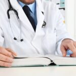 Healthcare credentialing specialist verifying physician qualifications for compliance and insurance enrollment