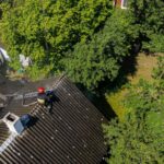 firefighter-sits-roof-burning-house_151992-1382