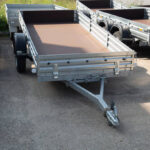 Open car trailer.Sale and rental of trailers for cargo transportation
