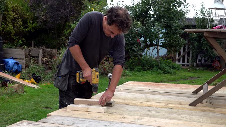 Man works in a workshop with tools in woodwork