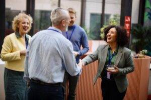 Conference speakers handshaking after presentation at the convention center