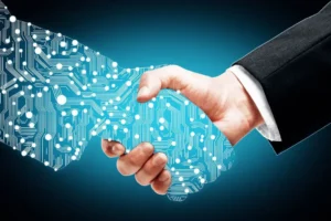 A hand holding a glowing, blue, circuit board-patterned shape that symbolizes digital transformation or technology