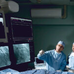 Doctors-looking-at-medical-device-screens