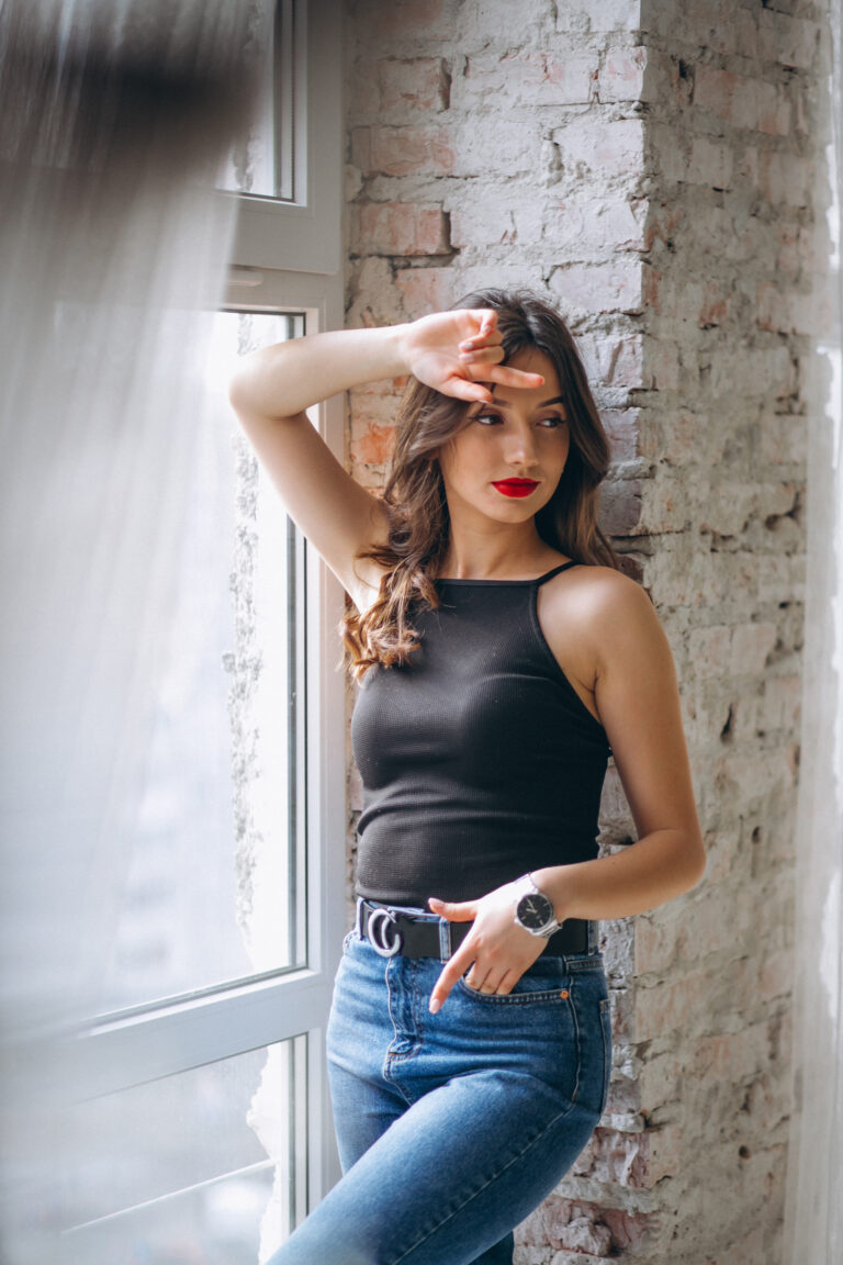Portrait of young happy woman in studio