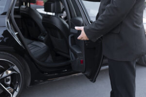 driver-with-opened-car-door-300x200.jpg