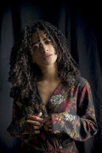 attractive-ethnic-woman-dark-dress