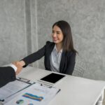 business-colleagues-talking-while-working-office