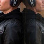 young-man-listening-music-headphones-close-up (1)