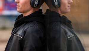young-man-listening-music-headphones-close-up (1)