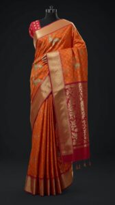 Your 670×376px photorealistic 3D Paithani saree image is ready — rich silk, gold zari, peacock motifs, studio lighting. 670px in width and 376px in height _ Size_ Maximum 200kb (1)
