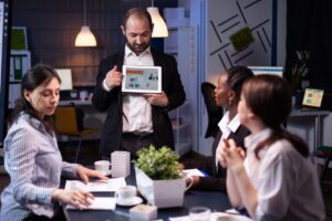 focused-businessman-showing-corporate-graphs-presentation-using-tablet-working-company-ideas (2)