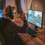 Teenager playing games on PC