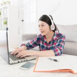 attractive sweet college student using computer