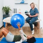 A,Young,Black,Client,Engages,In,Exercise,Rehabilitation,With,A