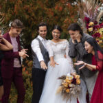 front-view-smiley-people-posing-wedding