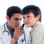 young-doctor-examining-little-boy-s-ears_13339-202770
