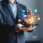 imgi_39_man-is-holding-tablet-with-lot-icons-it_548729-8712