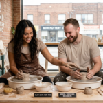 Couple laughing together while shaping clay on mini pottery wheels during a Clay Date for Two in Toronto.