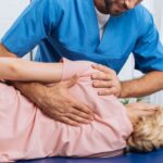 cropped-shot-of-chiropractor-massaging-back-of-pat-2024-11-19-00-48-36-utc-2048x1367