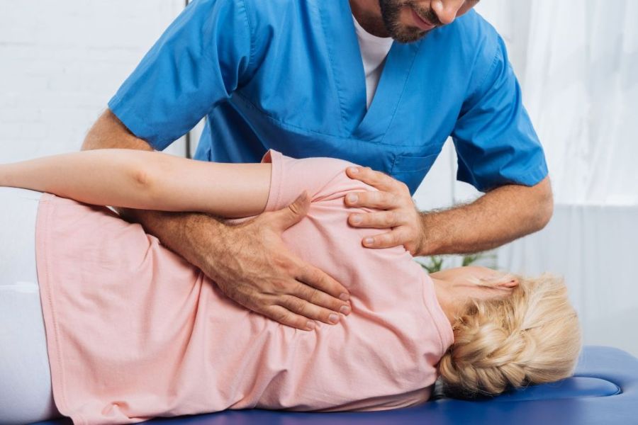 cropped-shot-of-chiropractor-massaging-back-of-pat-2024-11-19-00-48-36-utc-2048x1367