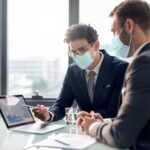 imgi_49_corporate-business-men-face-mask-working-office-new-normal_53876-96137